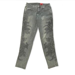 V Cristina grey and black embroidered jeans with floral pattern.